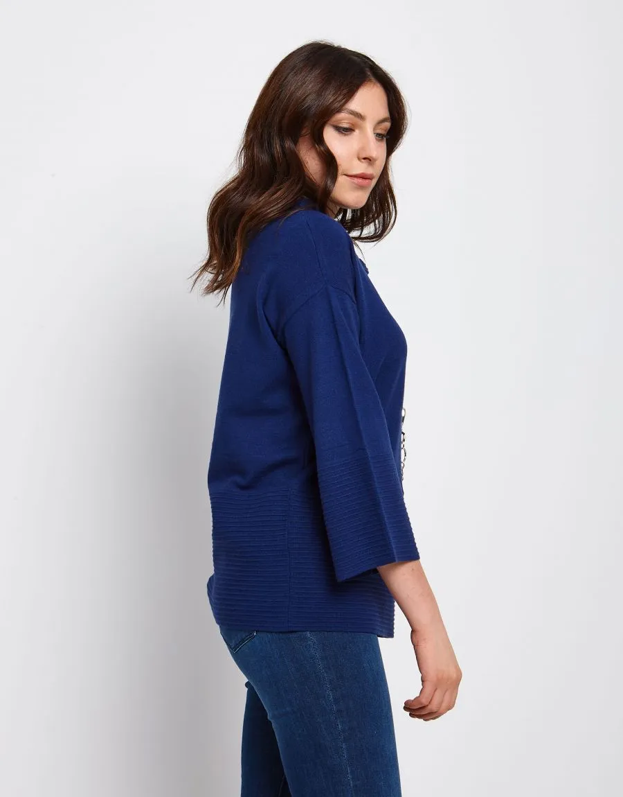 Maglia a poncho con collo alto