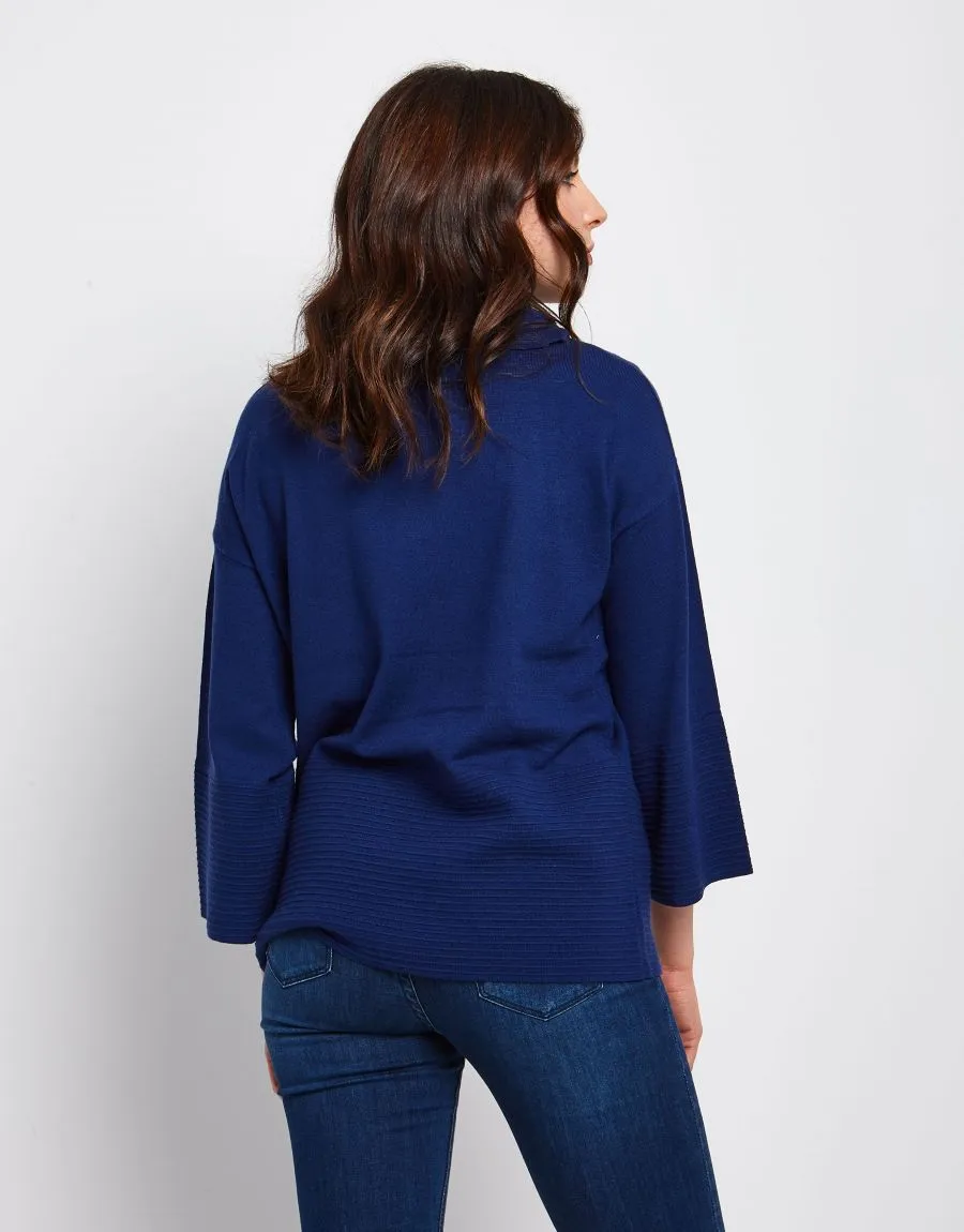 Maglia a poncho con collo alto